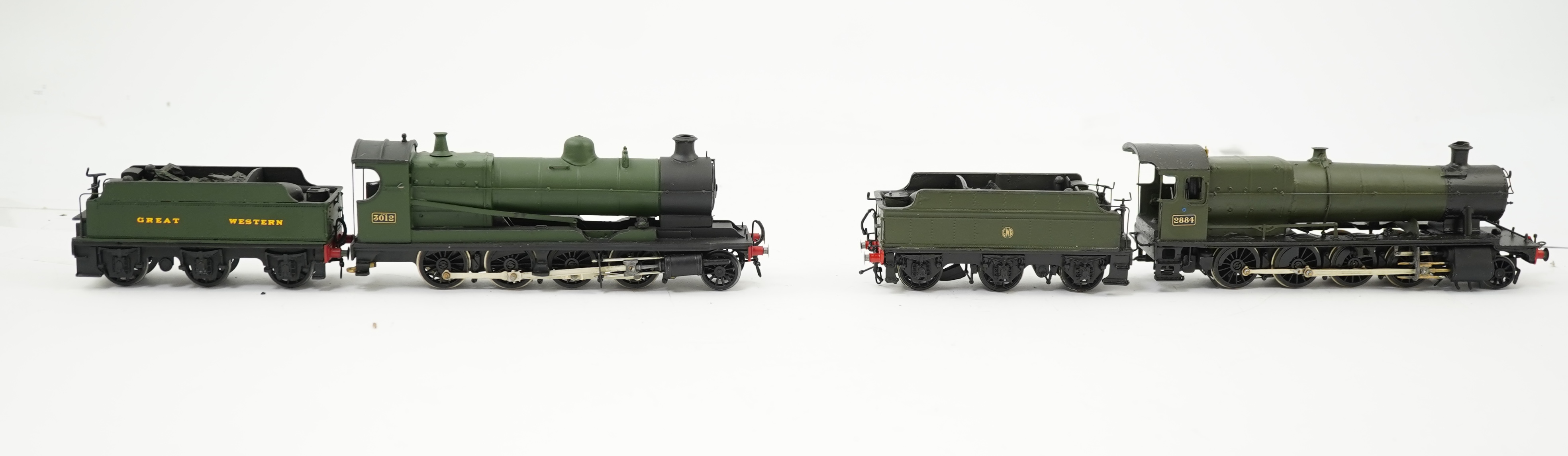 Three 00 gauge brass and white metal kit built GWR tender locomotives; a 2884 class 2-8-0, 2884, together with an 33xx class 4-4-0, 3454, and a War Dept. 2-8-0, 3012, all constructed, painted and lined to a high standard